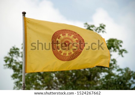 Buddhist flag on a pole in Thailand