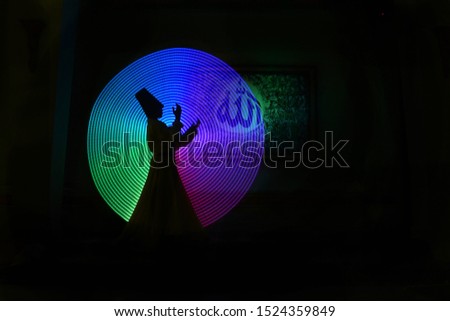 whirling Sufi dance in silhouette Royalty-Free Stock Photo #1524359849