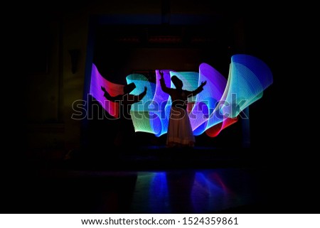 whirling Sufi dance in silhouette Royalty-Free Stock Photo #1524359861