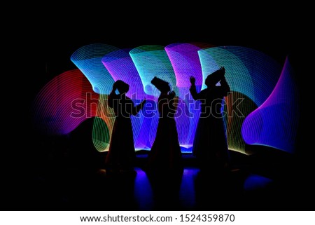 whirling Sufi dance in silhouette Royalty-Free Stock Photo #1524359870