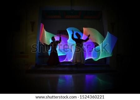 whirling Sufi dance in silhouette Royalty-Free Stock Photo #1524360221