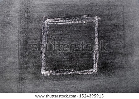 White chalk hand drawing in square or banner shape on black board background