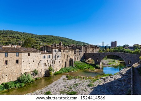 Perspective of the Romanesque bridge, was built in the 12th century. Lagrasse, Occitanie, France.