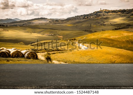 Autumn landscape of Tuscany and wooden board of free space for your decoration. Fall time and mood colors. 