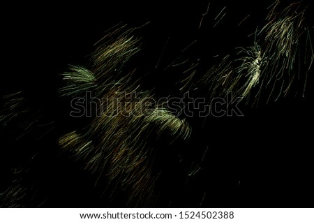 Spectacular fireworks show, color light sparks over black background.
