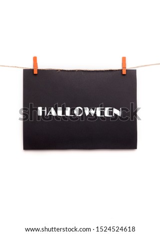 Halloween banner with white text hanging on rope, background, copy space