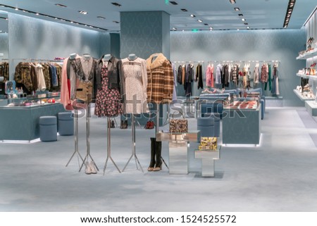 modern fashion store interior with luxury decoration in shopping mall Royalty-Free Stock Photo #1524525572