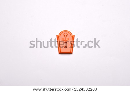 Halloween decorations tombs  on white background , Halloween holiday background , top view