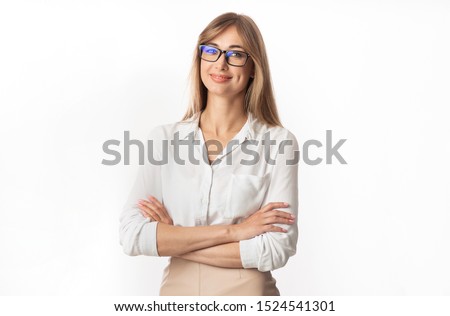 Successful Businesswoman. Positive Lady Smiling At Camera Standing Crossing Hands On White Studio Background. Isolated