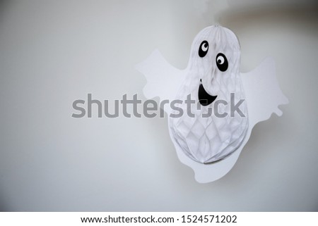 paper ghost on a white background.halloween