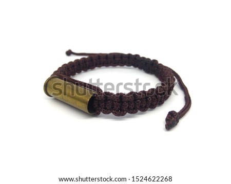 Closeup of amulet rope bracelet on white background.