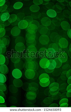 Beautiful festive green bokeh, evenly filling the entire field of the frame.