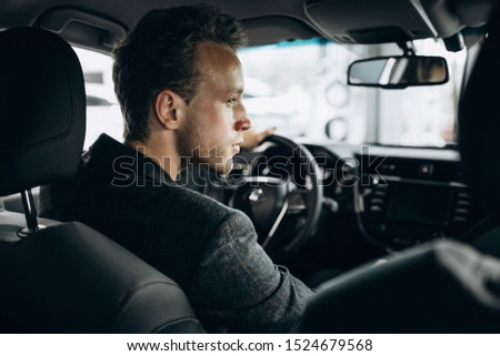 Business man sitting in a car