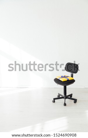 one black office chair in the interior of the white office