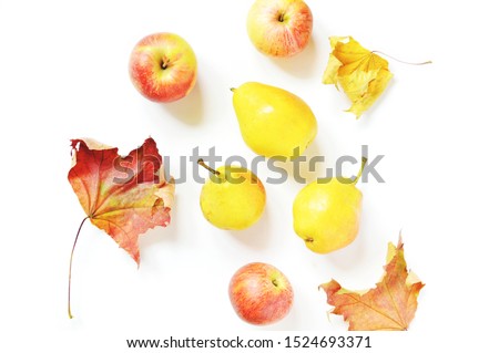 Flat lay fall season picture. Red apples, yellow juicy pears and maple leaves on a white background. Beautiful autumn composition, still life photo