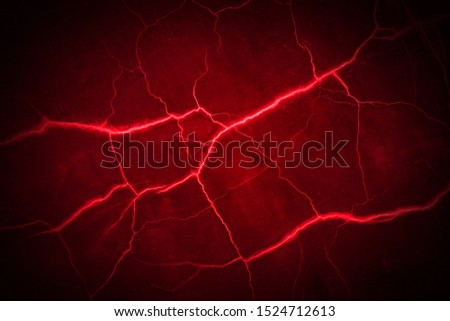 red cracks, red lightning on black background                               