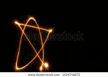 a picture clicked when a star is made with the help of a fire cracker . 