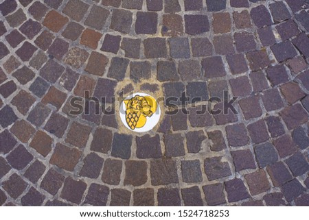 Pavement with a heart and an angel in Pesaro, Italy