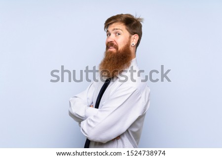 Businessman with long beard over isolated background laughing