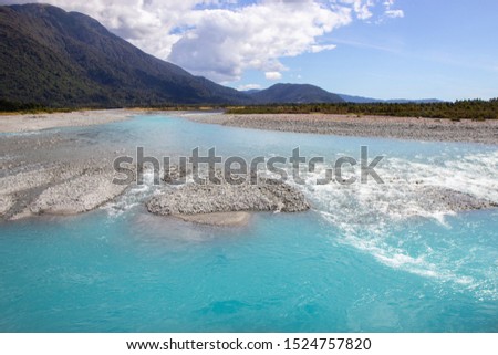river of melted glacial water, West coast of New Zealand, south island