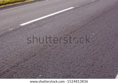 Asphalt track with a lane mark