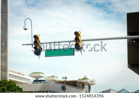 Blank directional road sign with the Traffic lights 