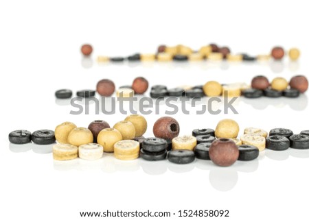 Lot of whole wooden bead in row isolated on white wood