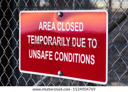 'Area closed temporarily due to unsafe conditions' posted sign Royalty-Free Stock Photo #1524904769