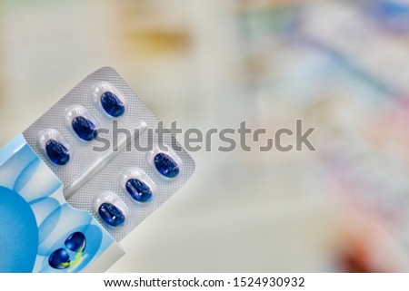 the blue soft gelatine capsules in Blister packaging is dispensing by pharmacist.