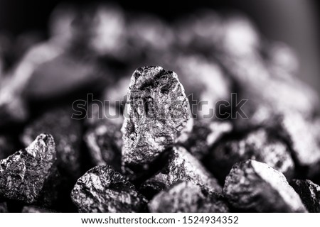 Aluminum nuggets, aluminum is a chemical element of the symbol Al and atomic number 13 with mass 27 u. At room temperature, it is solid, being the most abundant metallic element of the earth's crust. Royalty-Free Stock Photo #1524934352