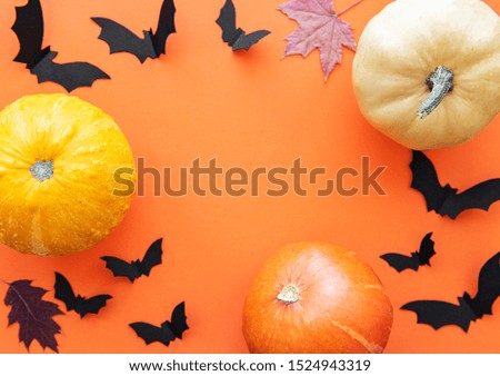 Halloween decorations on orange background. Halloween concept. Flat lay, top view, copy space