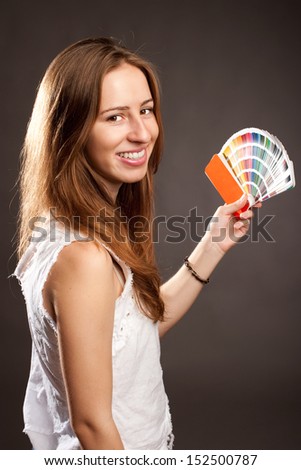 young woman holding a pantone palette