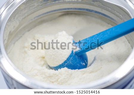 Powdered milk with spoon for baby Royalty-Free Stock Photo #1525014416