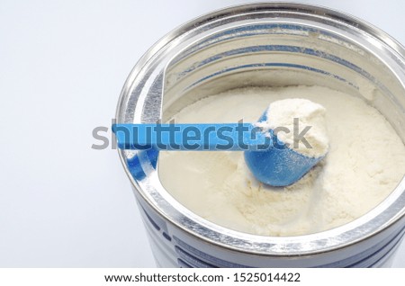 Powdered milk with spoon for baby Royalty-Free Stock Photo #1525014422