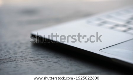Close up view  on silver office laptop on wooden table