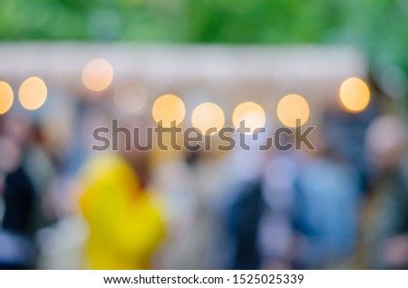 Blurred background. Blurred background on the street with lights-lanterns. Street festival. Festive atmosphere.