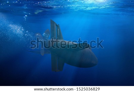 Naval submarine on a mission travelling under water Royalty-Free Stock Photo #1525036829