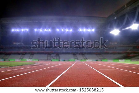 Empty running track in a stadium  Royalty-Free Stock Photo #1525038215