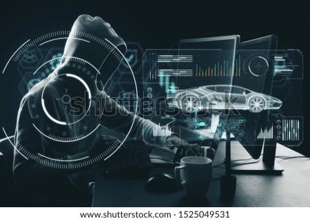 Side view of hacker at desktop using laptop with abstract digital car hologram on dark background. Automation and transport concept. Multiexposure 