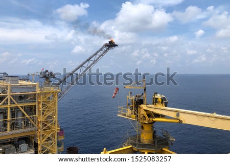 Aerial view of offshore living quarter platform or Offshore rig blue sky or Offshore oil and gas Accommodation Platform or Living Quarter and Production plant under a nice weather with supply boats