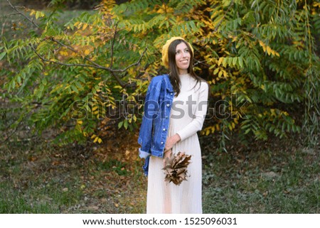happy woman with foliage in hands autumn park nature season emotions