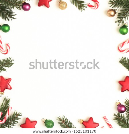 Christmas holiday background of fir branches, ornaments and candy canes. Xmas, Christmas, new year concept. Space for text