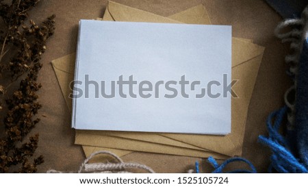 White empty card mockup for design of invitation, card or lettering on craft background
