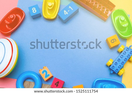 Colorful child kid’s education toys pattern background copy space mockup on the bright color background. Childhood education infancy children baby concept. Flat lay, top view, close up