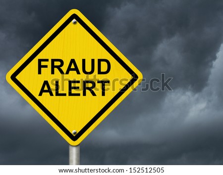 A road warning sign against a stormy sky with words Fraud Alert, Warning of Fraud Royalty-Free Stock Photo #152512505