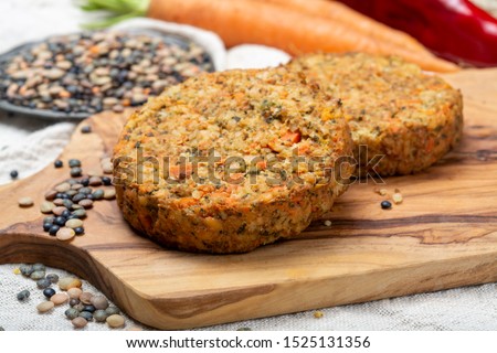Tasty vegetarian lentils burgers, healthy food close up Royalty-Free Stock Photo #1525131356