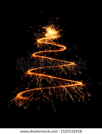 Shining lines made of sparklers on dark background