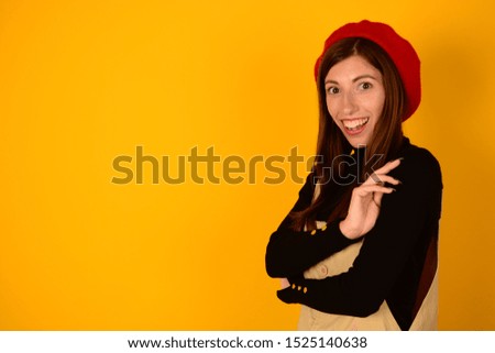 place free woman in red beret on a yellow background autumn