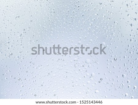 Water drops on glass,white Background and Texture, Rain droplets on glass background.