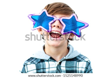 Laughing happy boy in funny big sunglasses in the shape of stars. Strong opinion of yourself. Schoolboy 10 years old. Isolated. A high self-evaluation conceit Royalty-Free Stock Photo #1525148990